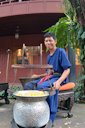 Thai man spools silk at Jim Thompson House